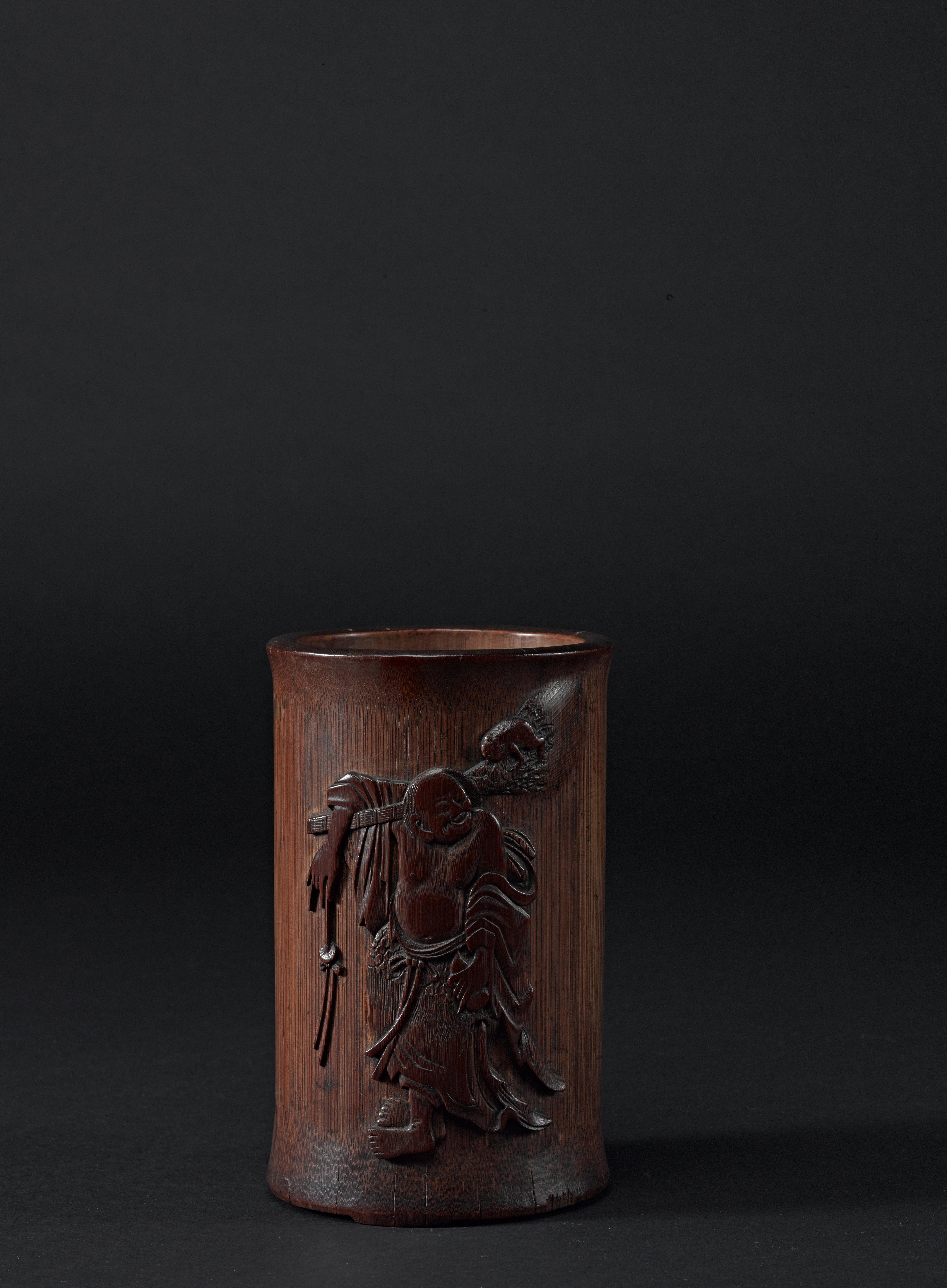 A carved inscribed bamboo 'plum tree' brush pot Qing dynasty